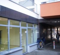 Offices on Lichnerova Street in Senec; glass facade and a bicycle at the entrance.
