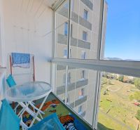 Glazed balcony of a 3-room apartment on Jesenná Street in Poprad with a view of the courtyard.