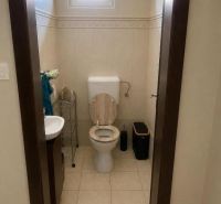Bathroom in a family house with a toilet and a sink.