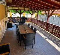 A terrace of a family house in Darnózseli with a grill and comfortable seating.