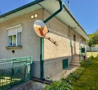 A family house in Lipany with a landscaped garden and a satellite on the facade.