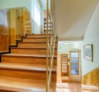 A staircase with a wooden decor floor in a family house.