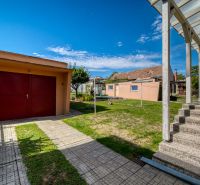 A family house on Sadova Street in Vrbové with a garage and a landscaped garden.