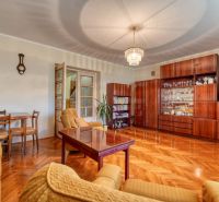 Living room in a family house with a sofa set, furniture, and a wooden decor floor.
