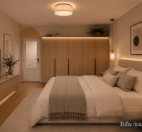 Bedroom in a 3-room apartment with a TV, bed, and wooden decor flooring.