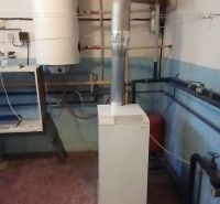 Heating and boiler in a family house with a wooden decor floor.