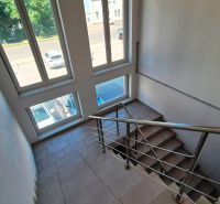 A staircase with large windows in a 2-room apartment, view of Levočská Street, Stará Ľubovňa.