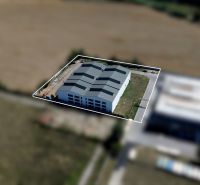 Warehouse and hall space in Trenčín on K výstavisku Street, surrounded by fields.