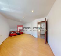 Interior of a family house with a wooden decor floor and a comfortable sofa.