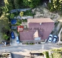 Aerial view of a family house with an adjacent garden and parking lot in Borinka.