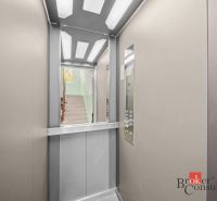 Elevator in a 3-room apartment with a view of the staircase.