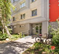 Entrance to the apartment building on E. F. Scherera in Piešťany with a bicycle.