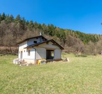 A family house in Lazy pod Makytou surrounded by meadows and forests, natural scenery.