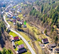 An aerial view of family houses in Lazy pod Makytou surrounded by forests.