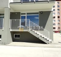 Commercial land in Senica with a staircase and a modern building facade.