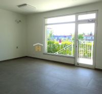 Spacious interior with a large window, suitable for commercial land.