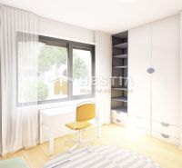 A room in a family house with a wooden decor floor, a table, and a chair.