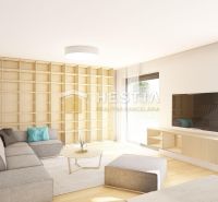 Living room with wood-patterned flooring, gray sofa, and shelves in a family house.