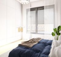 A bedroom in a family house with a delicate curtain, a large window, and a plant.