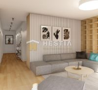 Living room of a family house with a grey sofa, wood-patterned flooring, and wooden shelves.