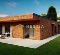 A family house in Hlboké with a terrace, brick facade, and garden seating.