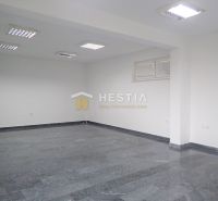 Commercial premises with ceramic flooring and white walls.