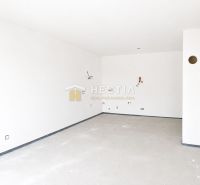 Spacious empty rooms with white walls in a family house.