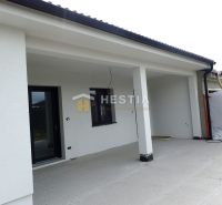 A family house in Hlboké with an open terrace and a white facade.