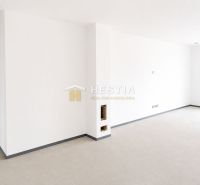 White interior wall in a family house with minimalist flooring and entrance door.