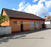A family house in Borský Mikuláš with an orange facade and a brown roof.