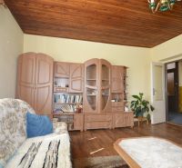 Living room with wooden decor furniture, wooden decor flooring, sofa.