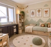Children's room in a family house with decorations and a bed, floor with wooden decor.