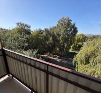 View from the balcony of a 2-room apartment on Pod hájkom Street in Skalica with plenty of greenery.