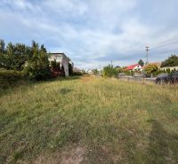 Plots - housing on Mlynská street, Veľké Ripňany, with grassy surface and houses in the background.