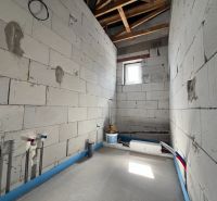 Unfinished commercial spaces with a view of raw walls in Lipany.