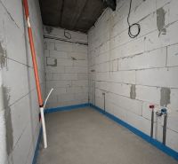 Unallocated commercial spaces with concrete flooring. Future infrastructure for installations.
