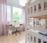 Children's room in a three-room apartment with a bunk bed and a table, floor with wooden decor.