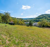 Residential plots in Sládkovičova, Považská Bystrica, surrounded by nature and offering views of the hills.