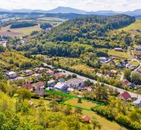 Land in Považská Bystrica on Sládkovičova Street, residential plots, surrounded by greenery.