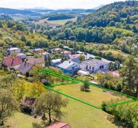 Plots - housing on Sládkovičova Street in Považská Bystrica, surrounded by greenery and houses.
