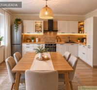 A kitchen in a family house with wooden decor, plants, and pendant lighting.