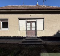 A family house in Tvrdošovce with a simple facade and entrance stairs.