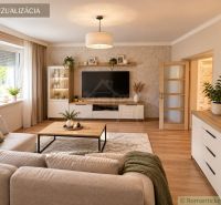 A living room of a family house with a wooden decor floor and a comfortable sofa.