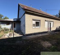 A family house with a brick facade and a tiled roof in Tvrdošovce.