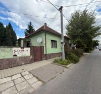A family house on Šulekova Street in Nové Zámky, surrounded by greenery and a sidewalk.