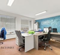 Offices equipped for work including desks, chairs, and cabinets, with flooring decor.