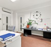 Cozy offices with wall clocks, written papers, and a plant on the side.