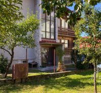 A family house on 17. novembra Street in Stará Ľubovňa, surrounded by greenery and trees.