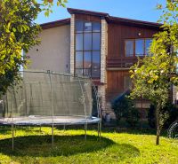 A family house on 17. novembra Street in Stará Ľubovňa with a trampoline in the garden.