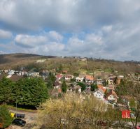 View of the residential area with houses and greenery in Bratislava-Karlova Ves on Donnerova Street.
